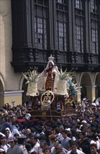 PERU, Lima, Traditional May 1st Festival with effigy of Virgen de Chapi being carried above the