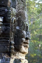 CAMBODIA, Angkor, The Bayon. One of the faces of the late twelth to early thirteenth century