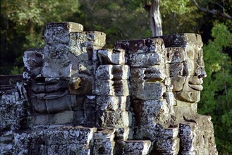 CAMBODIA, Angkor, The Bayon. Two of the faces of the late twelth to early thirteenth century