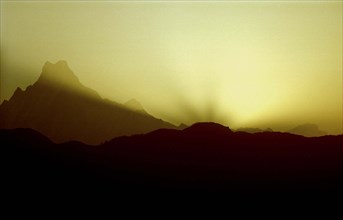 NEPAL, Annapurna Massif, Mountain range in silhouette at sunset viewed from Poon Hill
