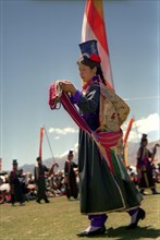 INDIA, Ladakh, Dancer at the 14th Dalai Lamas birthday celebrations
