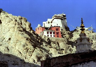 INDIA, Ladakh, Leh, View looking up at the cliff top Gompa