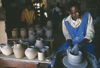 MALAWI, Dedza, Pottery producing fair trade goods for export.