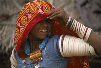 INDIA, Rajasthan, Thar Desert, Bhansda village.  Smiling young woman from farming caste chodri