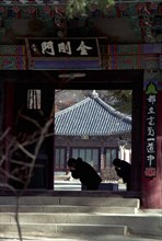 SOUTH KOREA, Songnisan National Park, Popchusa, View through Temple corridor with sillhouette of