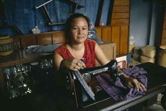 VIETNAM, Work, Female dressmaker at her sewing machine.