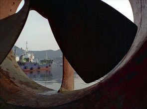 SOUTH KOREA, Pusan, View of moored ship seen through large propeller