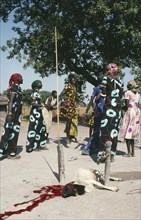SUDAN, Festivals, Dinka sacrificial ceremony.  The three women wearing the same dress are all
