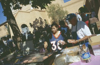 USA, New Mexico, Albuquerque, Making burgers in San Felipe de Neri church grounds in the old town