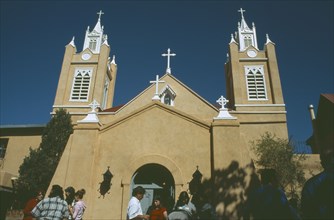 USA, New Mexico, Albuquerque, Tourists outside San Felipe de Neri church in the old town plaza