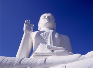 SRI LANKA, Mihintale, Large white seated Buddha