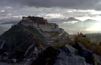 CHINA, Tibet, Lhasa, View toward the hilltop Potala Palace seen in evening light