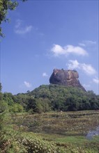SRI LANKA, Sigiriya, View towards huge monolithic rock site of fith century citadel.  Also called