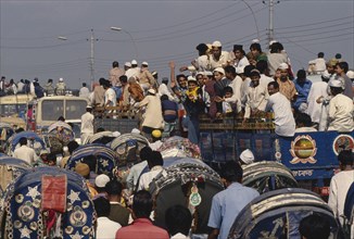 BANGLADESH, Dhaka, Trucks full of Muslim devotees returning from annual Biswa Itema gathering.
