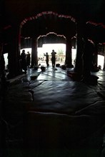 CHINA, Tibet, Lhasa, View looking out from inside the Jokhang Temple with people prostrating