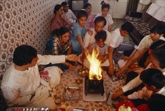 ENGLAND, Religion, Hindu, Hindu family participating in head shaving ceremony of young son in