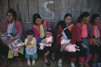THAILAND, North, Baan Mae Suai, Lisu women and babies.