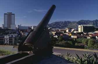 COSTA RICA, San Jose, View over city with old cannon in the foreground