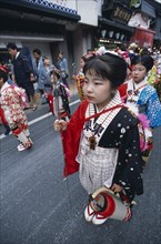 JAPAN, Chiba, Narita, 10-12 year old girls called tekomae in traditional kimono walking in front of