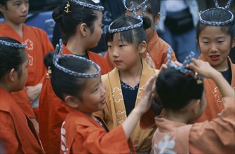 JAPAN, Chiba, Tako, 10-12 year old girls called tekomae in traditional costume during July Gion