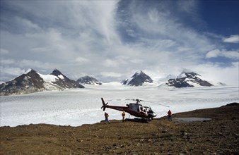 USA, Alaska, Near Skagway, Landed helicopter on rocky ground near Juneau icefield