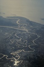BANGLADESH, Ganges Delta, Aerial view over meandering river and tributaries.