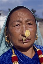 NEPAL, East, Sokropati, Limbuni woman tribeswearing traditional gold Limbu nose jewellery