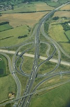 ENGLAND, Essex, Transport, Aerial view of the M25 junction with the M11 at Epping.