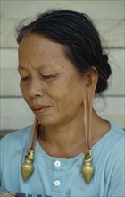 MALAYSIA, Sarawak, Long Lama woman wearing heavy earrings in stretched ear lobes