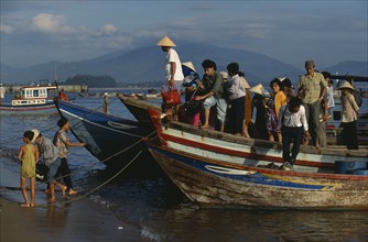 VIETNAM, Nha Trang, Cau Dau , Passengers coming ashore from a ferry at this fishing village