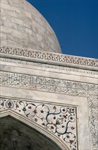 INDIA, Uttar Pradesh, Agra, Detail of semi precious stones inlaid in white marble with Arabic