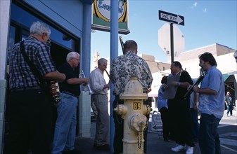 USA, New Mexico, Santa Fe, Jazz musicians outside Evangelo’s restaurant bar