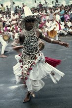SRI LANKA, Kandy, Dancer in the Perahera annual festival procession