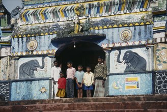 SRI LANKA, Nurawa Eliya, Tamils standing in the entrance to a Hindu temple on a tea plantaion