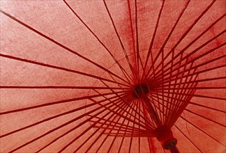 THAILAND, Baw Sang, Inside view of red painted umbrella in village outside Chiang Mai which