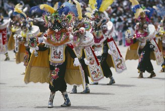BOLIVIA, Oruro, Carnival masqueraders in colourful animal costumes