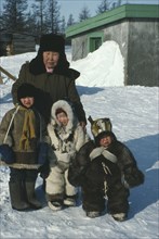RUSSIA, Siberia, Kamchatka, Koriak family wearing assorted fur coats