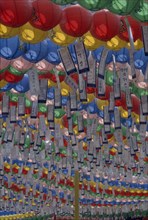 SOUTH KOREA, Seoul, Jogyesa Temple.  Canopy of paper lanterns and prayer streamers hung to