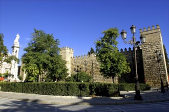 SPAIN, Andalucia, Seville, Crenellated exterior wall of the Royal Alcazar