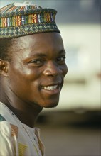 NIGERIA, People, Portrait of smiling young Ibo man.