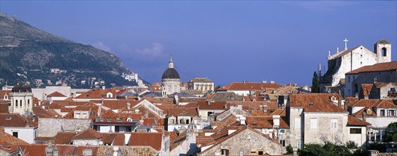 CROATIA, Dalmatia, Dubrovnik, View through a slit in the City Walls over the rooftops looking