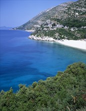 CROATIA, Dalmatia, Makarska Coast , Gradac. View along the rocky coastline with small sandy beach