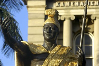 USA, Hawaii, Oahu, Honolulu. King Kamehameha statue wearing gold hat and holding a staff