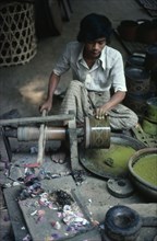 MYANMAR, Bagan, Man working in lacquer factory workshop.