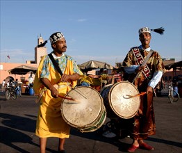 MOROCCO, Marrakech, Two drummers standing in the market place