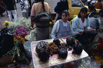 MEXICO, Michoacan State, Patzcuaro, Sugared pumpkin for Day of the Dead for sale in street market.