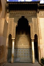 MOROCCO, Marrakech, Saadian Tombs. Ornate archway with paterned tile decoration