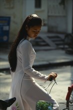 VIETNAM, North, Hanoi, College girl wearing traditional Ao Dai.