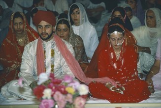 WEDDING, Sikh, Bride and groom at Sikh wedding ceremony.