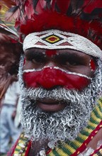 PAPUA NEW GUINEA, Tribal People, Eastern Highlander with painted face wearing bead necklace.